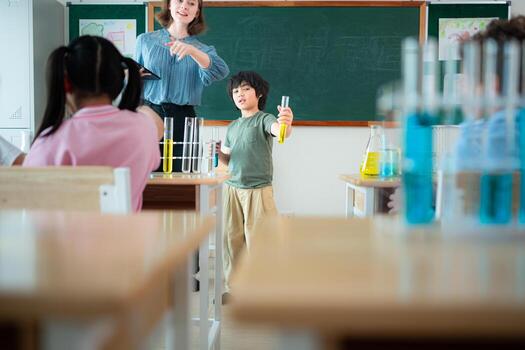 Teacher and students, Learn and experiment with science in a school science classroom. photo