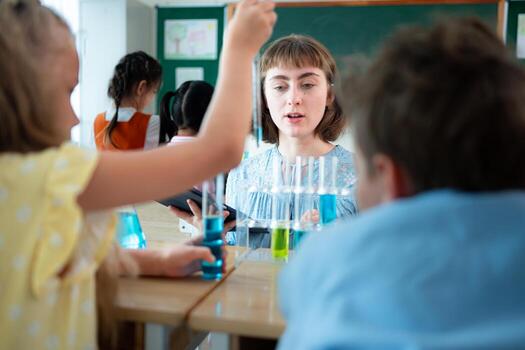 Teacher and students, Learn and experiment with science in a school science classroom. photo