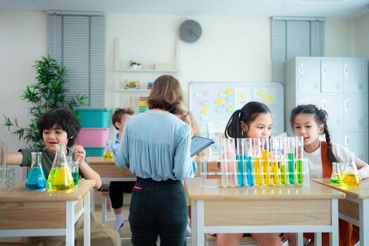 Teacher and students, Learn and experiment with science in a school science classroom. photo