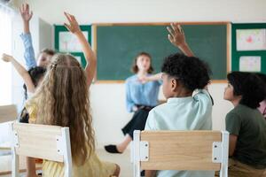 Teacher and students, Learn and study in a classroom of school where youngsters sit and listen attentively. photo