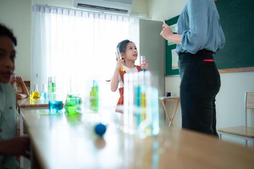 Teacher and students, Learn and experiment with science in a school science classroom. photo
