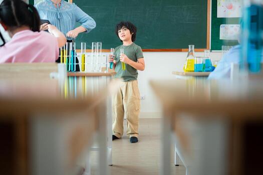 Teacher and students, Learn and experiment with science in a school science classroom. photo