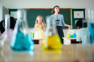 Teacher and students, Learn and experiment with science in a school science classroom. photo