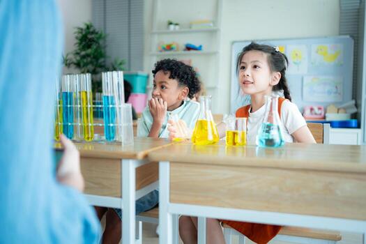 Teacher and students, Learn and experiment with science in a school science classroom. photo