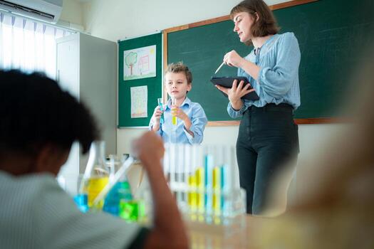 Teacher and students, Learn and experiment with science in a school science classroom. photo
