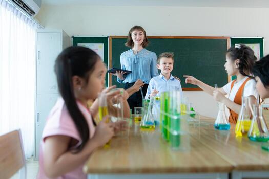 Teacher and students, Learn and experiment with science in a school science classroom. photo