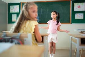 Children with classroom presentation activities in front of the classroom photo