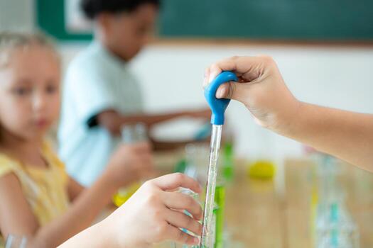 Teacher and students, Learn and experiment with science in a school science classroom. photo
