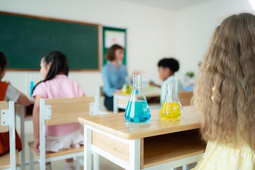 Teacher and students, Learn and experiment with science in a school science classroom. photo