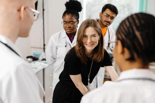 Instructor teaching first aid cardiopulmonary resuscitation course and use of automated external defibrillator workshop photo