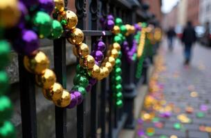 Vibrant Mardi gras beads on french quarter iron railings photo