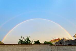 A double rainbow in the sky photo