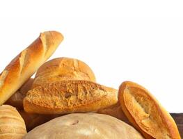 A pile of breads on a table photo