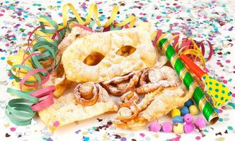 A bunch of colorful confetti and candy on a white background photo
