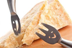 A cheese knife with a smiley face on it photo