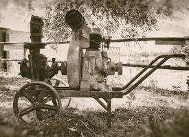 An old fashioned gas engine on a cart photo