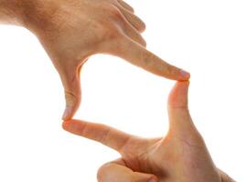 Two hands forming a square shape on a white background photo
