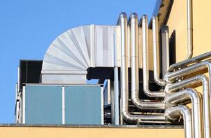 A close up of pipes on a building photo