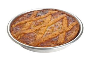 A cake in a metal pan on a white background photo