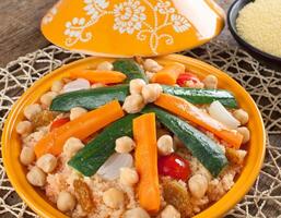 A plate of food with vegetables and rice photo