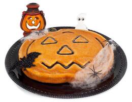 A halloween pumpkin cake with a ghost and a pumpkin photo