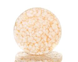 A round piece of white cheese on top of a white background photo