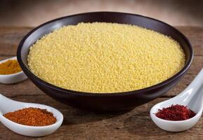A bowl of couscous with spices and other ingredients photo