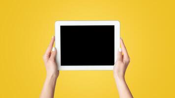 Cropped view of millennial girl showing tablet computer with mockup for design on screen against white background, panorama photo