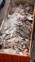 Building rubble and debris ready to be disposed of and recycled. photo