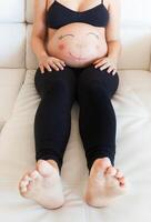 Belly with smiley face. photo