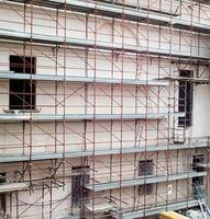 Scaffolding installed on a building under renovation. photo