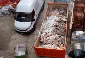 Building rubble and debris ready to be disposed of and recycled. photo