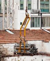 Moving steel with crane. photo