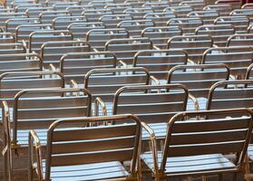 Empty metal seats places in public space photo