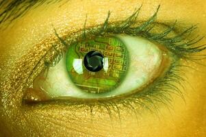 A close up of a woman's eye with a computer chip in it photo