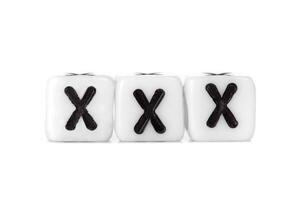 Three dice with black crosses on them photo