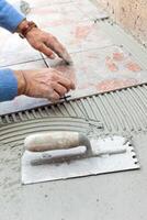 Tiler to work with tile flooring photo