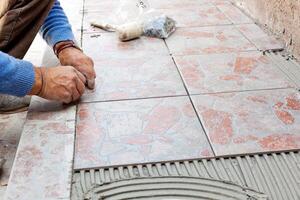 Tiler to work with tile flooring photo