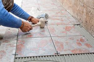 Tiler to work with tile flooring photo