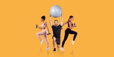 Three individuals are engaging in a fitness routine, using dumbbells and a stability ball. The setting features a vibrant yellow backdrop, enhancing the energetic atmosphere of the activity. photo