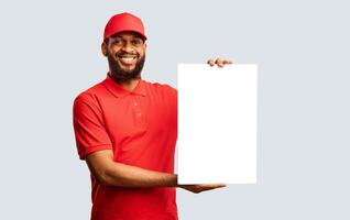 Delivery Service. African American Courier Man Holding Blank White Board For Text Smiling To Camera Posing On Yellow Background. Mockup photo