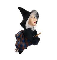 Befana, witch with flying broom photo
