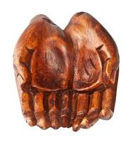 Hands of wood carved by hand. photo