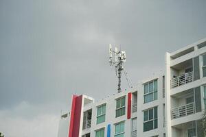 A building with a cell phone tower on top of it photo