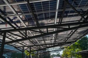 A large solar panel array on the roof of a building photo
