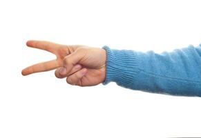 Concept of number two or scissors with hand photo