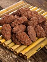 Cocoa beans, dark chocolate and chocolate truffles photo