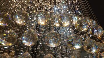 A chandelier with many crystals hanging from it photo