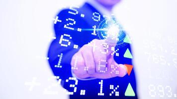 A man in a suit pressing a button on a screen photo