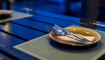 A table with a plate and a bowl on it photo